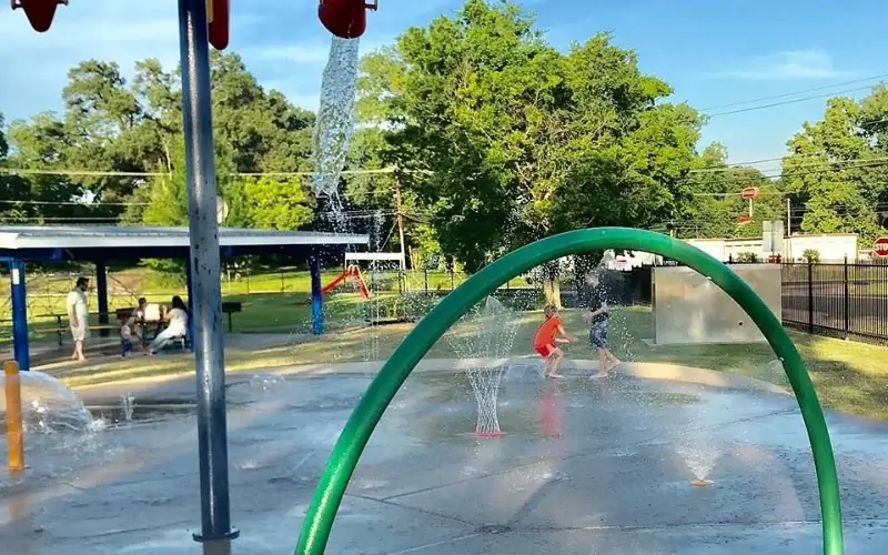 Children playing in water spray park